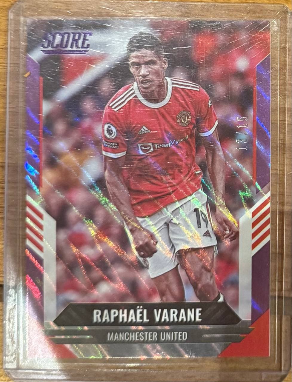 2022–23 Panini Score Premier League #118 Raphaël Varane Purple Laser /15